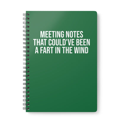 Green notebook with humorous text on a white background