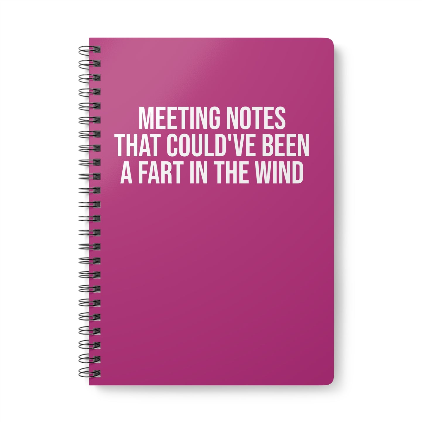 Pink notebook with humorous text on a white background