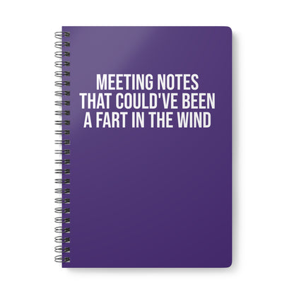 Purple notebook with humorous text on a white background