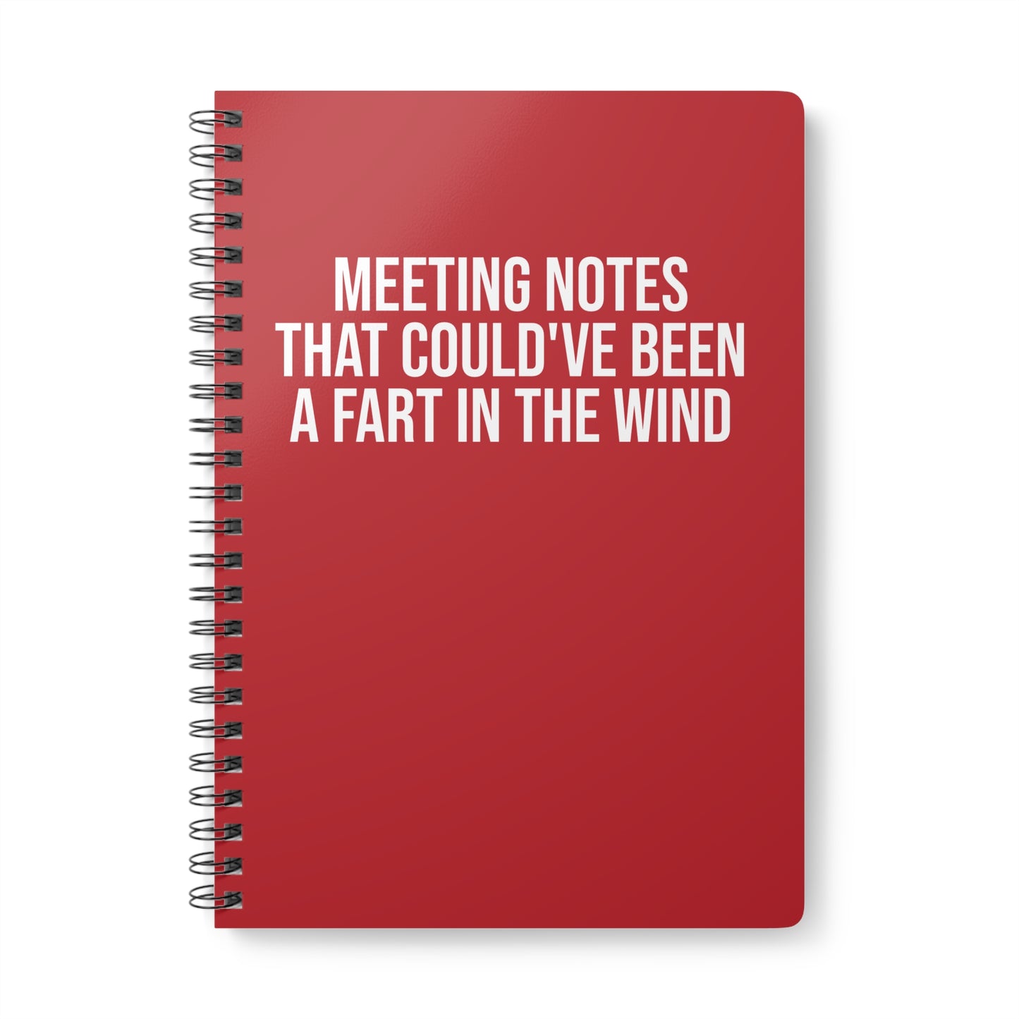 Red notebook with humorous text on a white background
