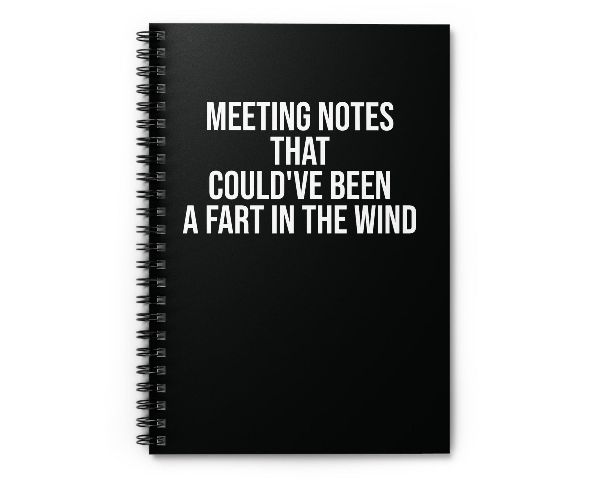 Black notebook with humorous text on a white background