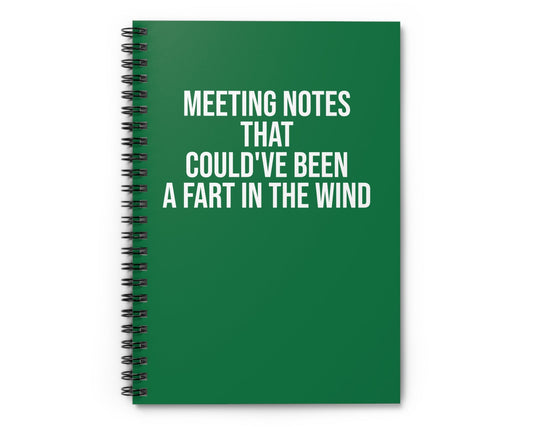 Green notebook with humorous text on a white background