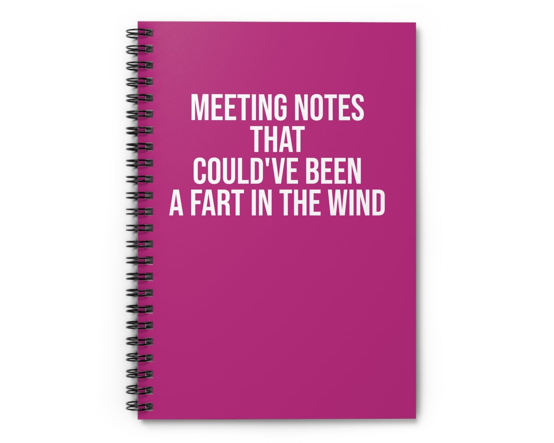 Pink notebook with humorous text on a white background