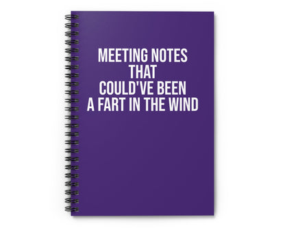 Purple notebook with humorous text on a white background