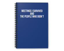 Blue notebook with white text on a white background