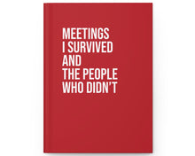 Red notebook with white text on a white background