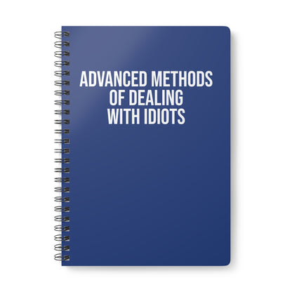 Blue notebook with white text on a white background