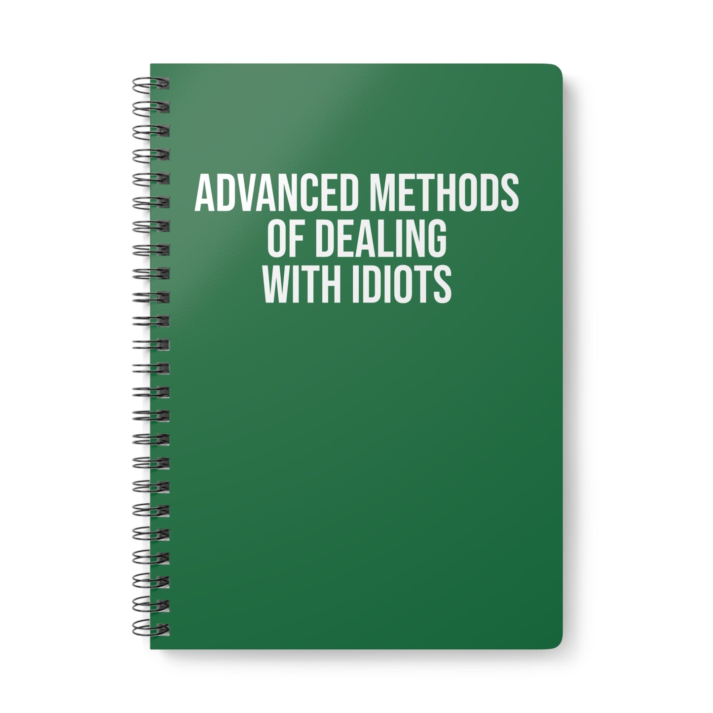 Green notebook with white text on a white background