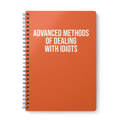 Orange notebook with white text on a white background