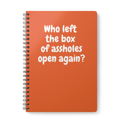 orange notebook with sarcastic “Who left the box of assholes open again?” quote