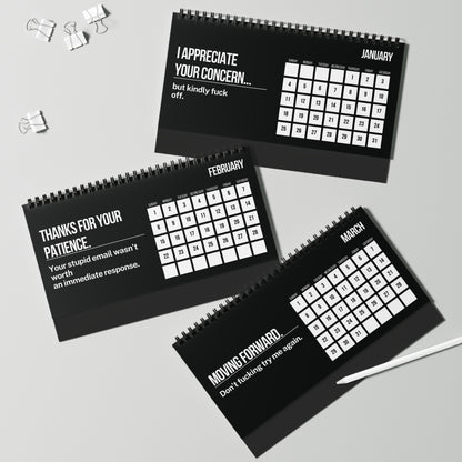 Three black spiral-bound calendars with white text on a gray background