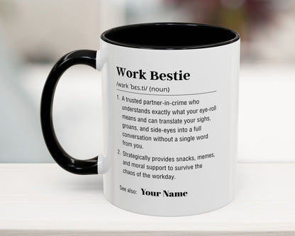 White mug with black interior and handle, featuring text definition on a blurred background
