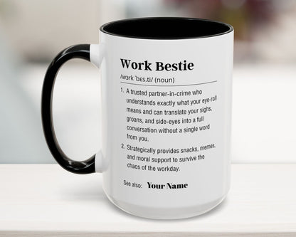 Mug with text definition of 'Work Bestie' on a blurred background