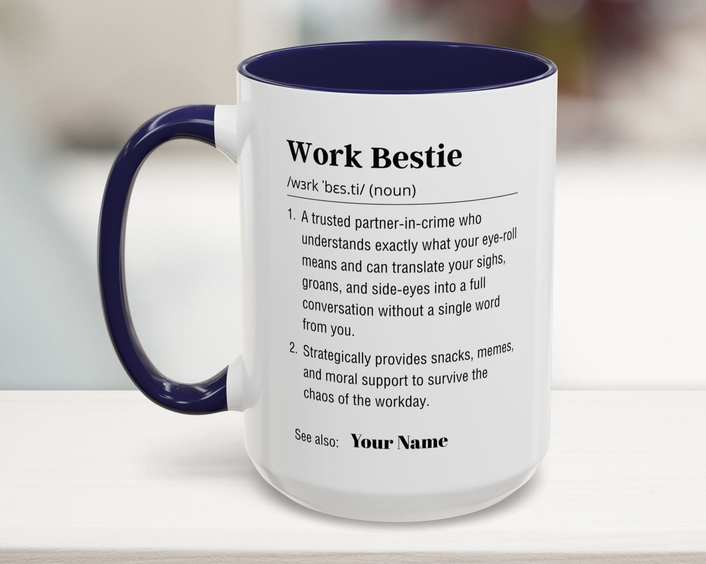 Mug with 'Work Bestie' definition text on a blurred background