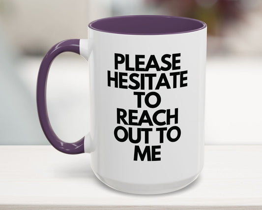 White mug with purple handle and interior, featuring text on a blurred background