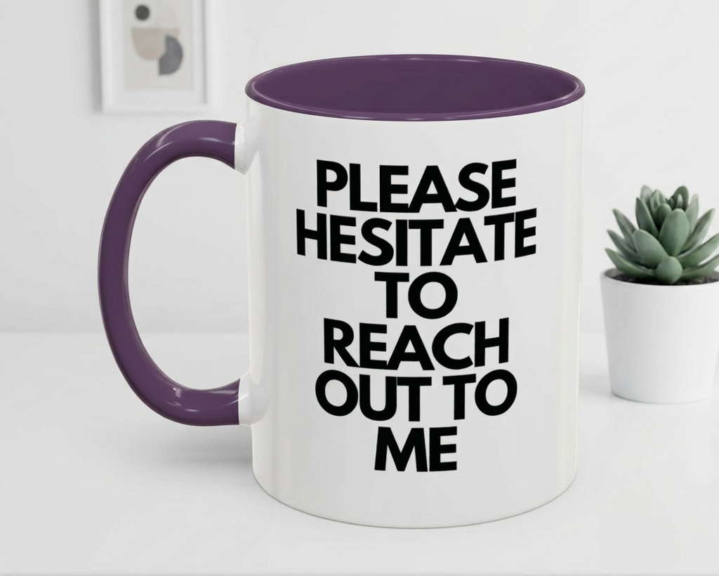 White mug with purple handle and interior, featuring text 'PLEASE HESITATE TO REACH OUT TO ME' on a white surface.