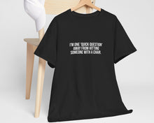 Black t-shirt with a logo on a wooden hanger against a white background