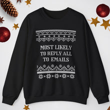Black sweater with text 'Most Likely to Reply All to Emails' on a white background with Christmas decorations.
