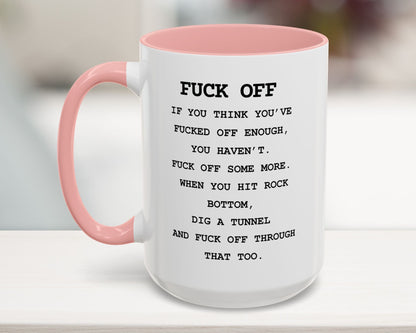 Mug with pink handle and text on a blurred background
