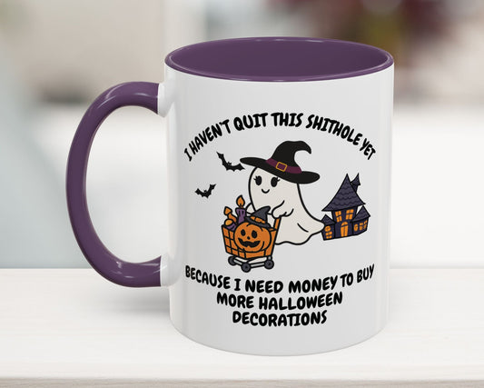 White mug with purple handle featuring Halloween-themed design and text.