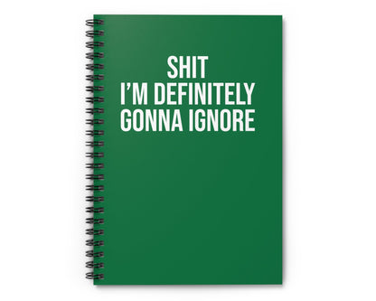 Green notebook with white text on a white background