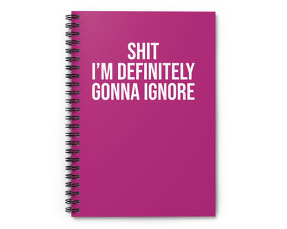 Pink notebook with white text on a white background