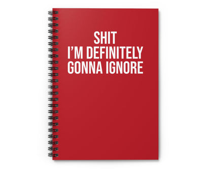 Red notebook with white text on a white background