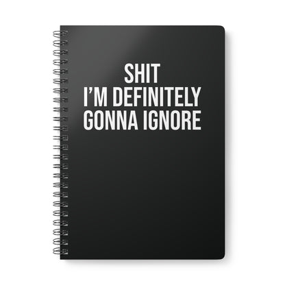 Black spiral-bound notebook with white text on a white background