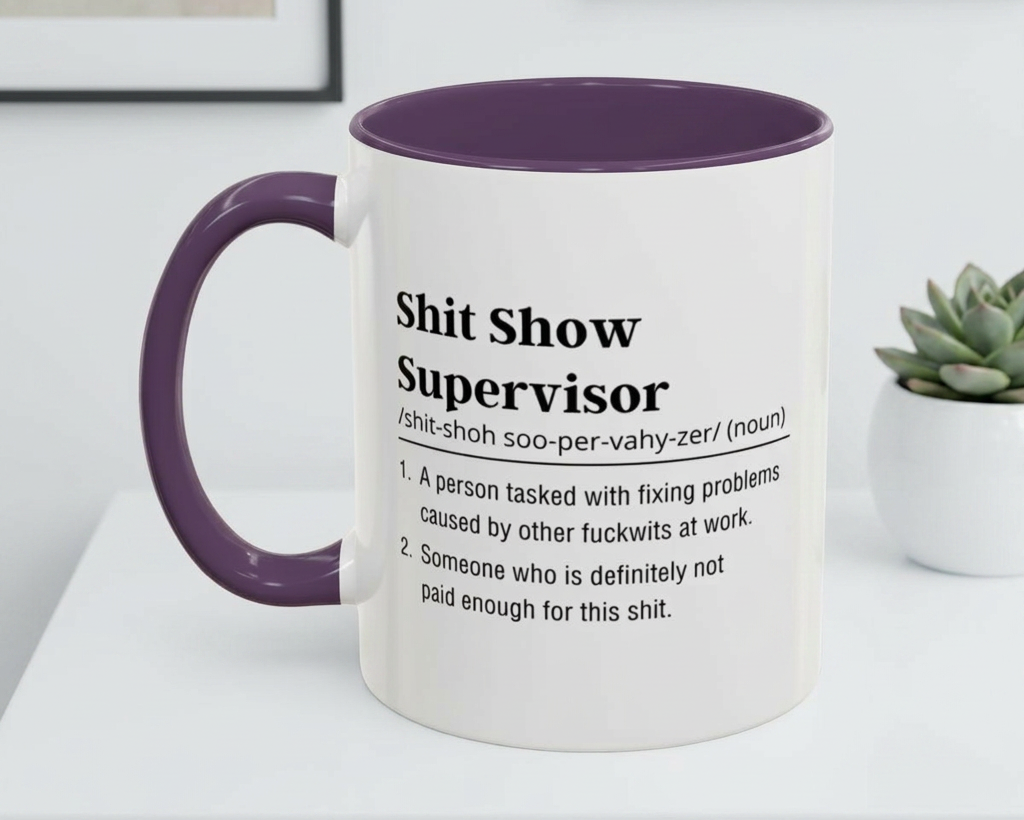 Mug with purple handle and interior, featuring text on a white surface.