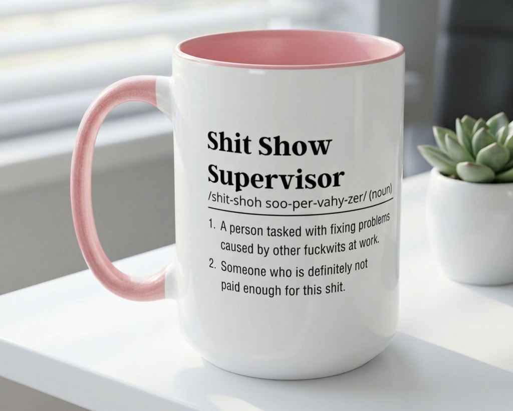 Mug with pink interior and handle, featuring text on a white surface.