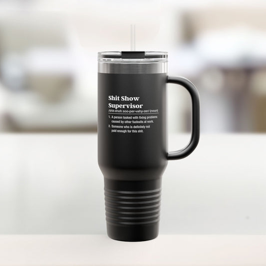 Shit Show Supervisor Black travel mug with text on a white surface