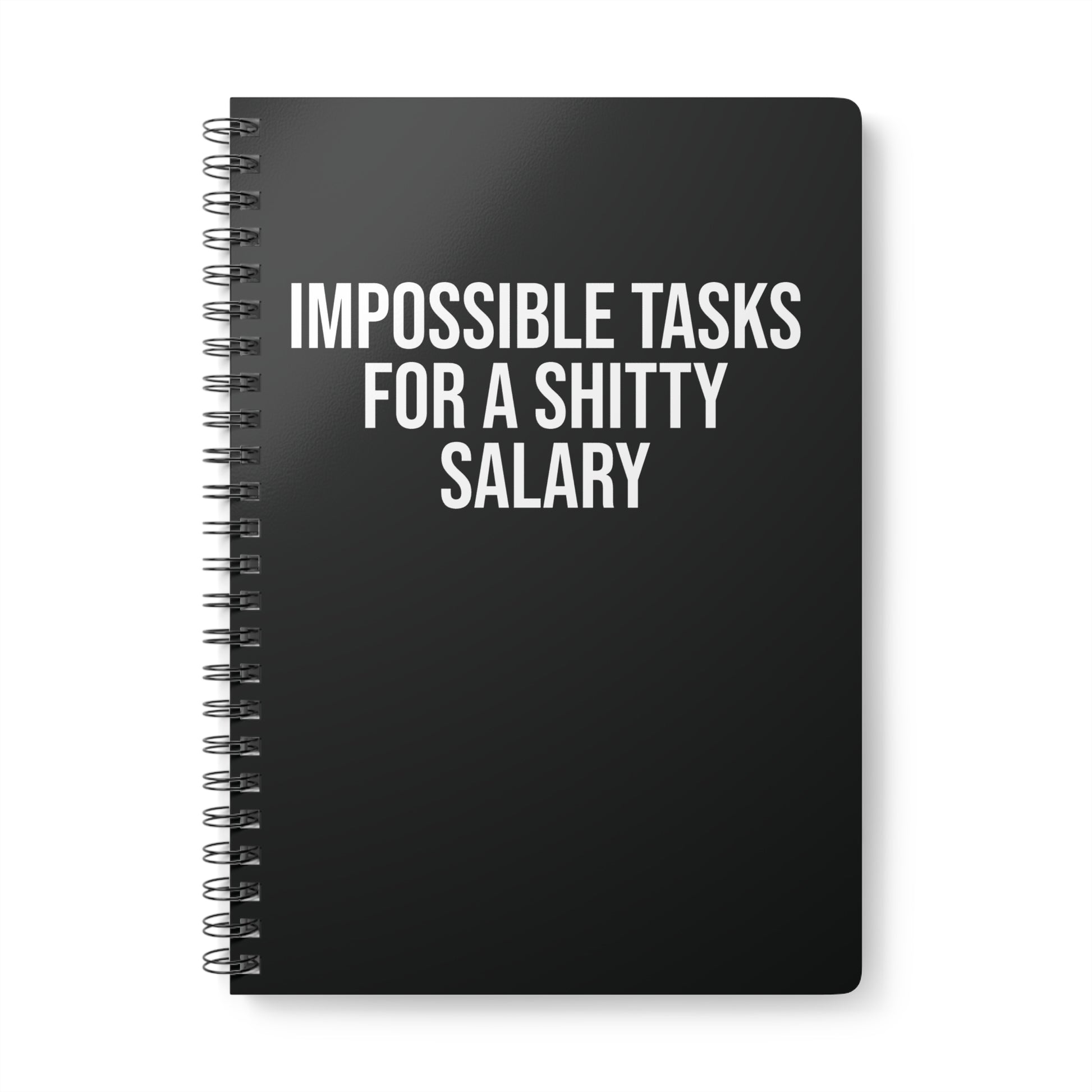 Black spiral-bound notebook with white text on a white background
