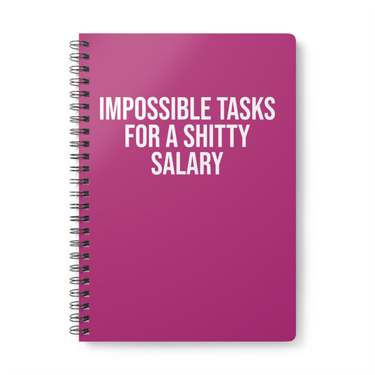 Pink notebook with white text on a white background