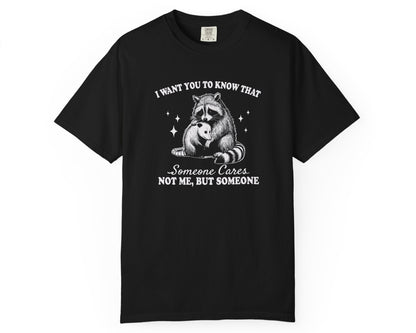 Black unisex T-shirt with raccoon hugging possum and quote: ‘Someone Cares Not Me But Someone’