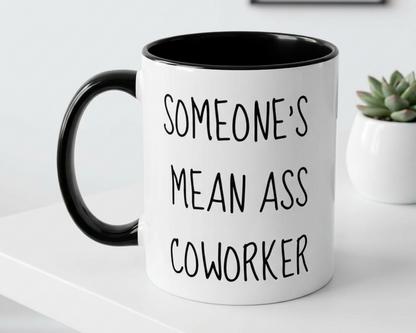 White mug with black interior and handle, featuring text, on a white surface.