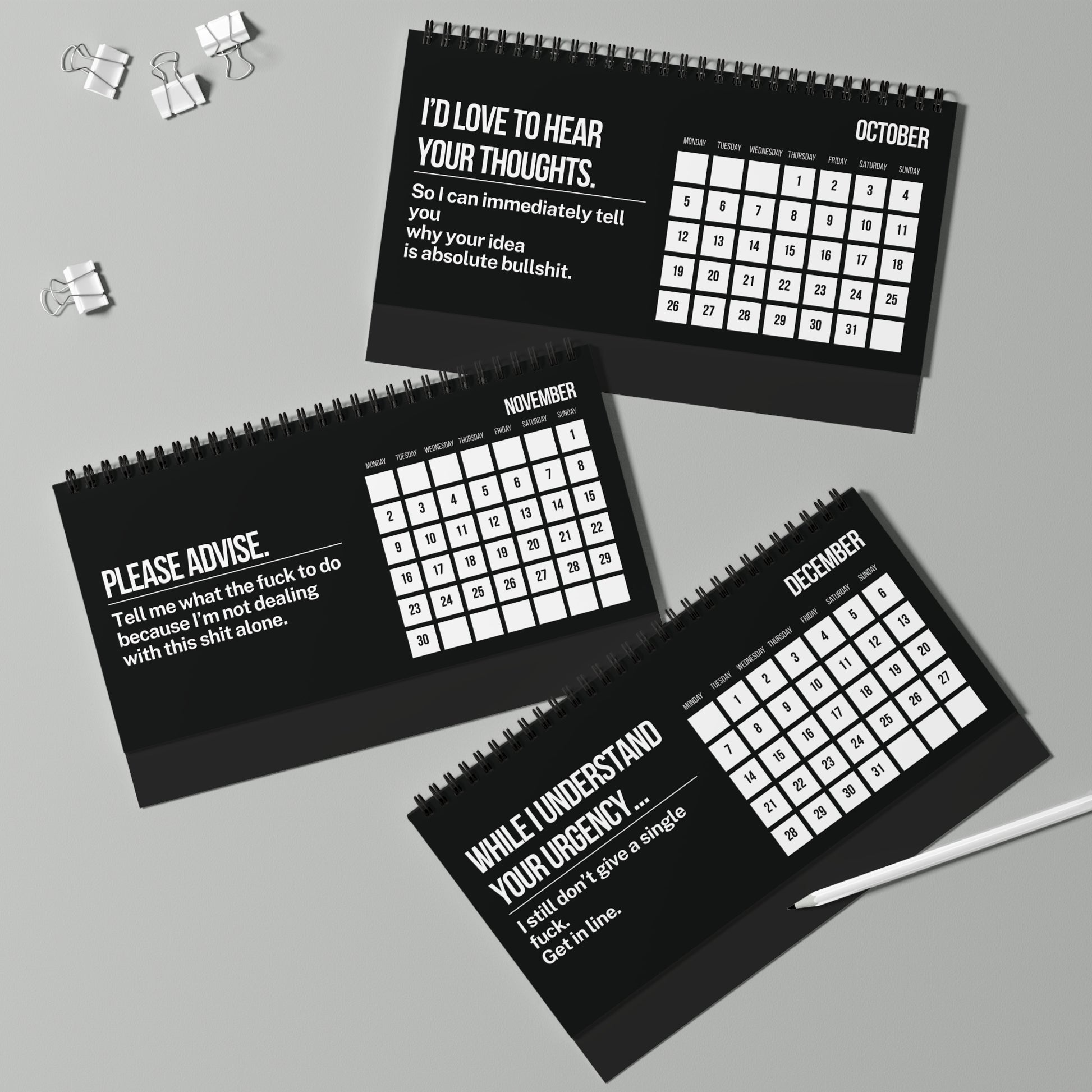 Three black calendars with humorous text on a gray background