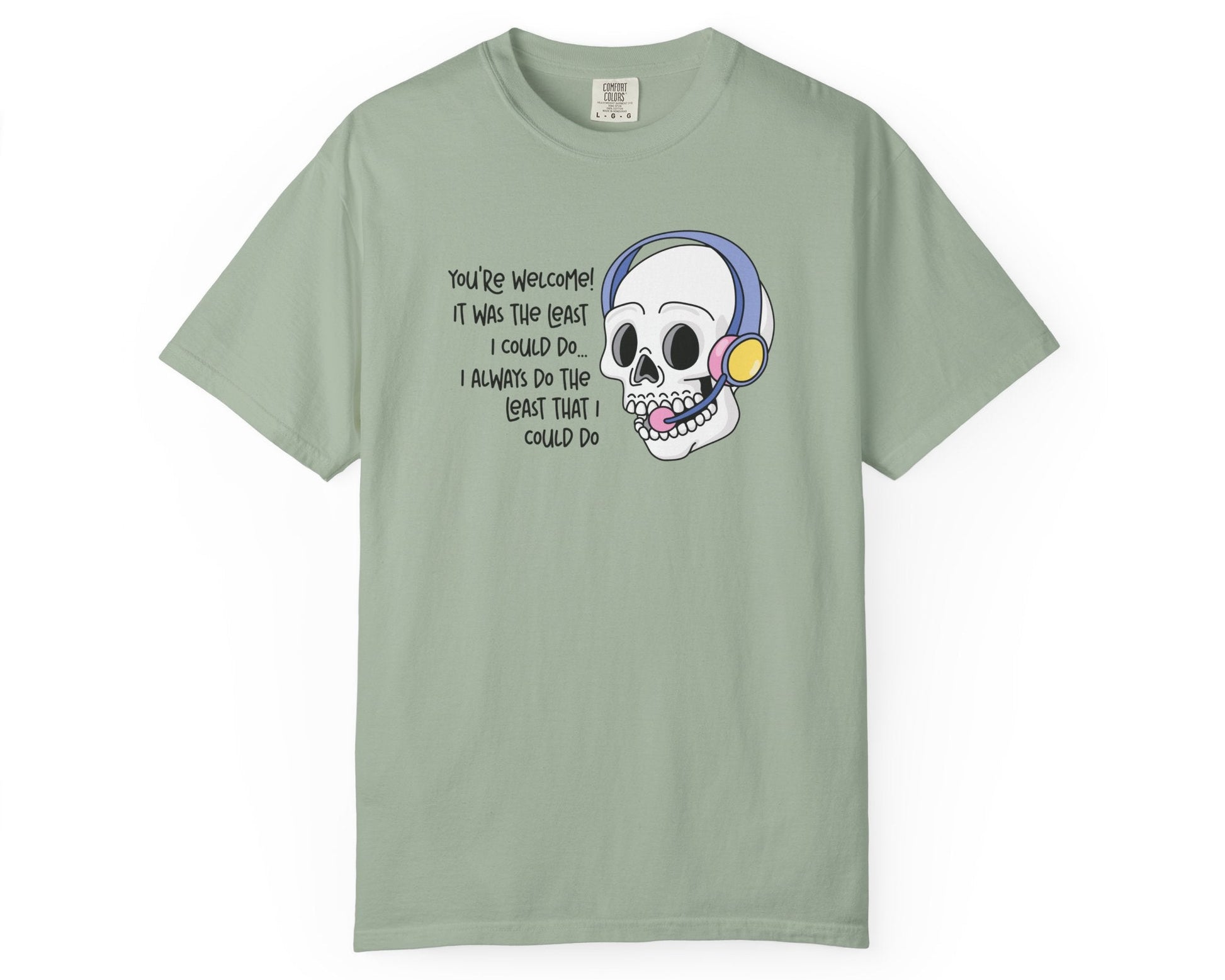 Light green t-shirt with a cartoon skull design and text on a white background