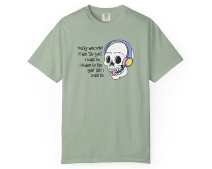 Light green t-shirt with a cartoon skull design and text on a white background