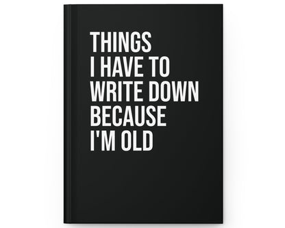 Black notebook with white text on a white background