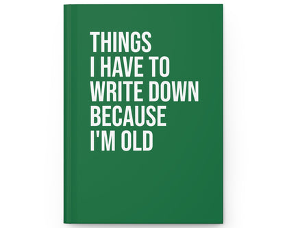 Green notebook with white text on a white background