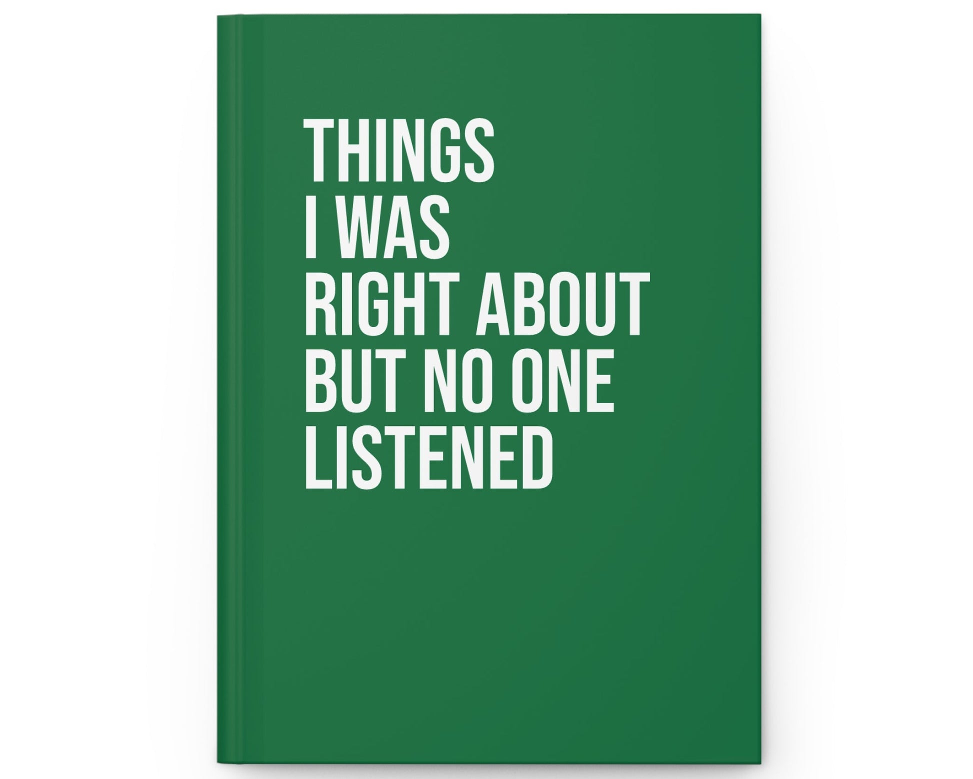 Green notebook with white text on a white background