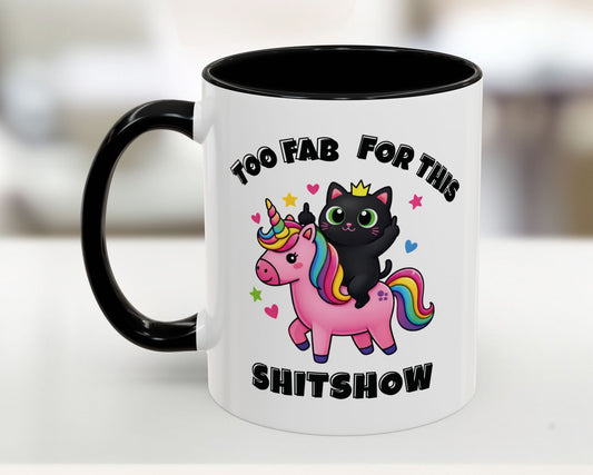 Mug with a black cat on a unicorn, text 'Too Fab for this Shitshow', on a white background.