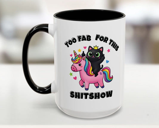 White mug with black handle featuring a black cat on a pink unicorn with text 'Too Fab for this shitshow'.