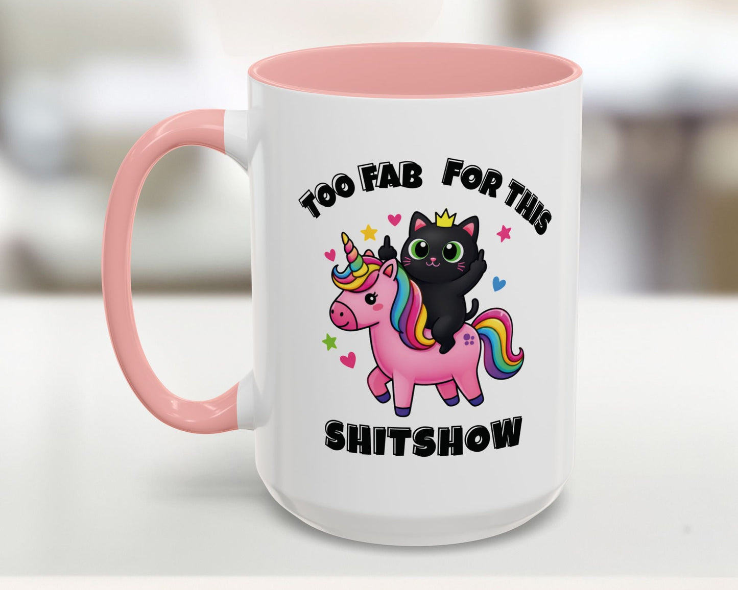White mug with pink interior and handle, featuring a black cat on a unicorn with text 'Too Fab For This Shitshow'.