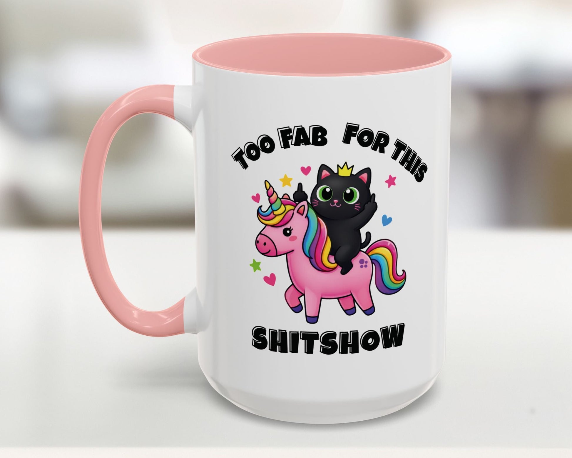White mug with pink interior and handle, featuring a black cat on a unicorn with text 'Too Fab For This Shitshow'.