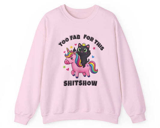 Pink sweatshirt with a black cat and unicorn graphic and text on a white background