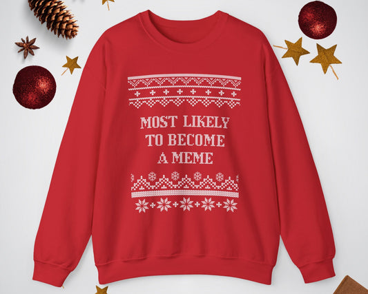 Red sweatshirt with white text and patterns on a light gray background with Christmas decorations.