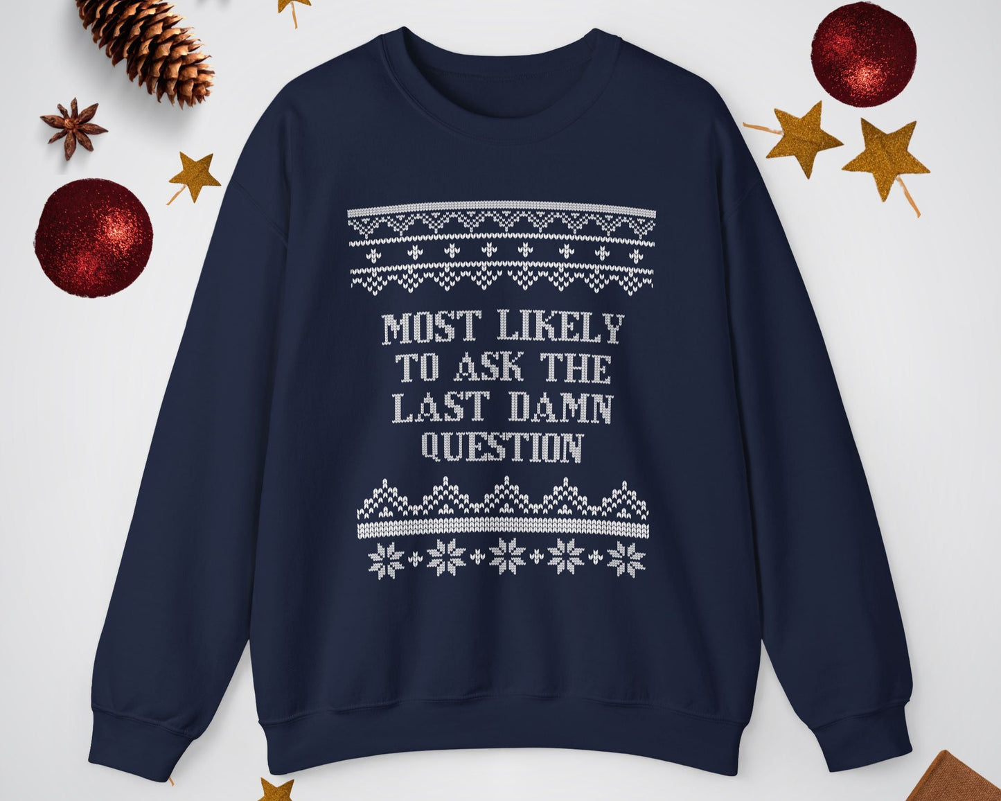 Navy blue sweatshirt with white text and patterns on a light gray background with decorative items.