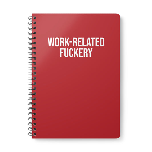 Red notebook with white text 'WORK-RELATED FUCKERY' on a white background