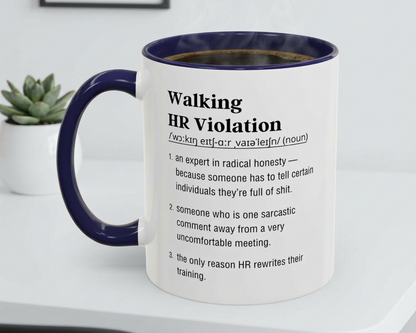 Mug with humorous definition text on a white surface with a plant in the background